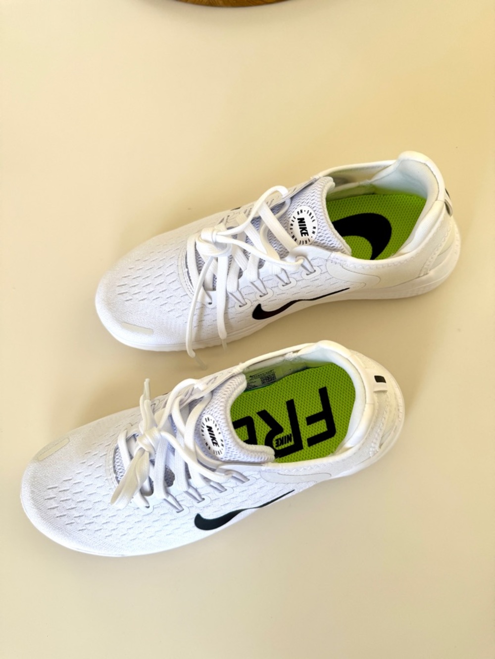 Nike White Running Shoes with Black Swoosh and Neon Green Insoles